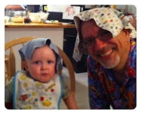 Man and child with blankies on their heads