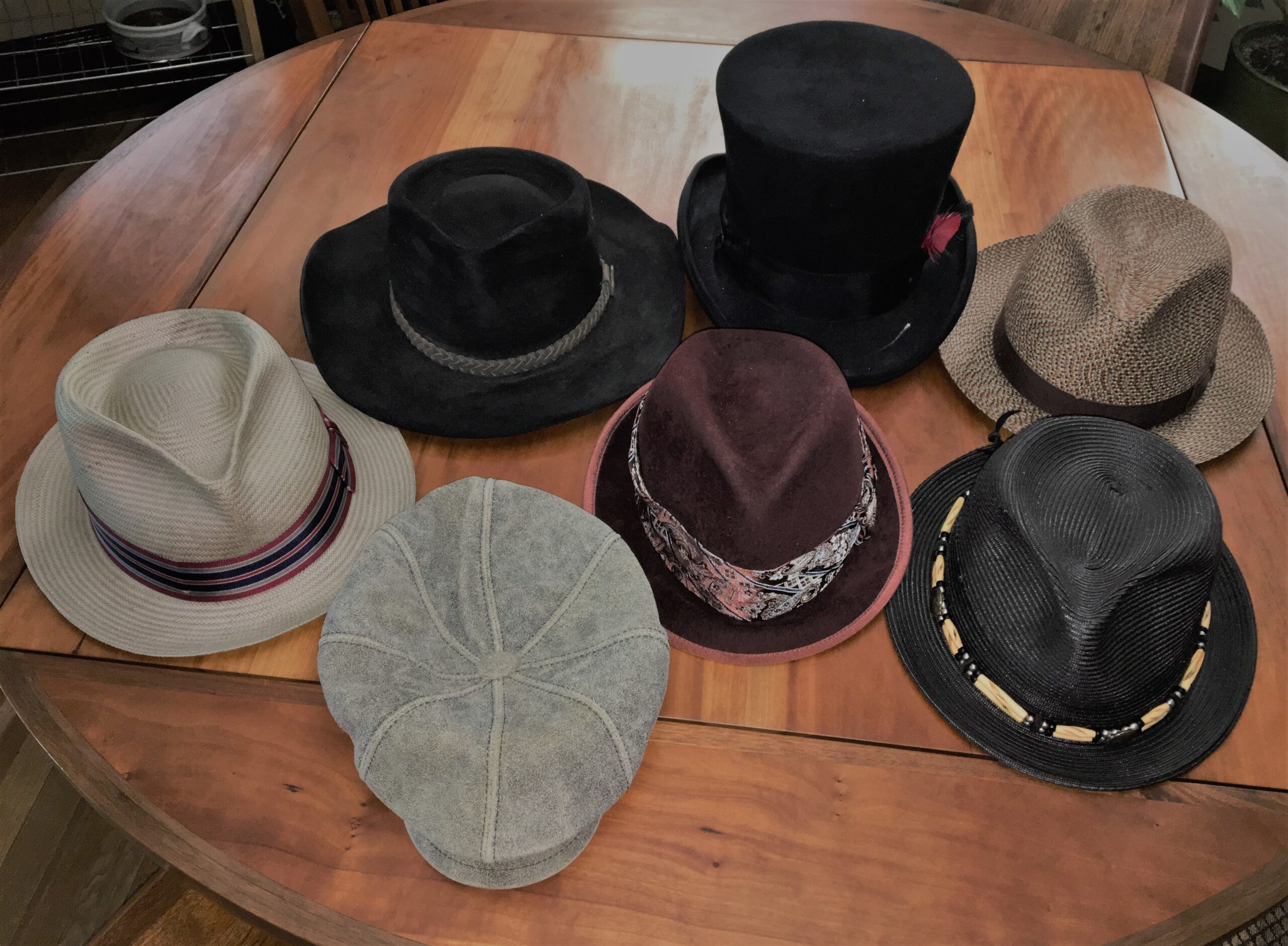 7 hats on table