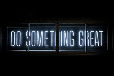 Neon sign saying Do Something Great