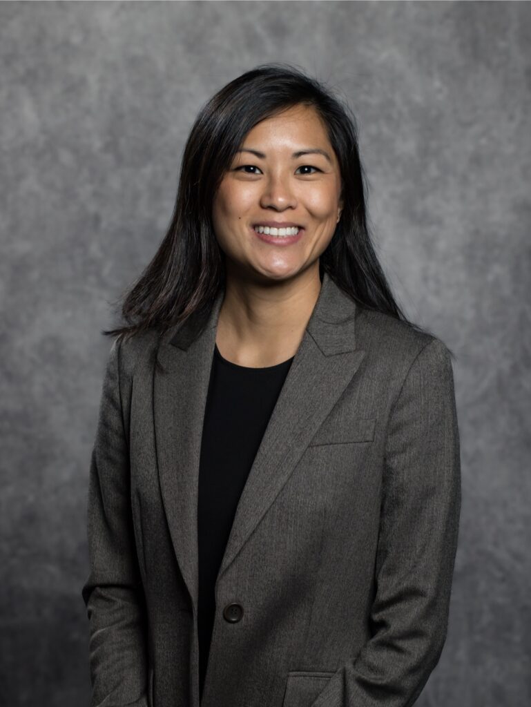 Woman with black hair smiling