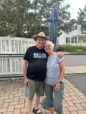 Man and woman posing on patio