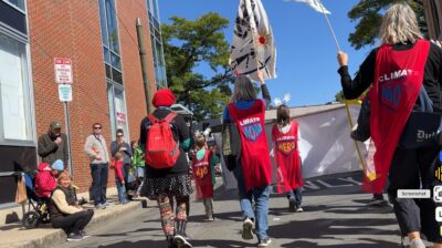 Marching in parade from behind