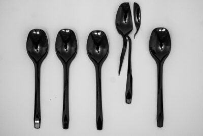 Row of black spoons