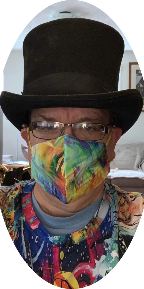 Man in top hat and colorful mask