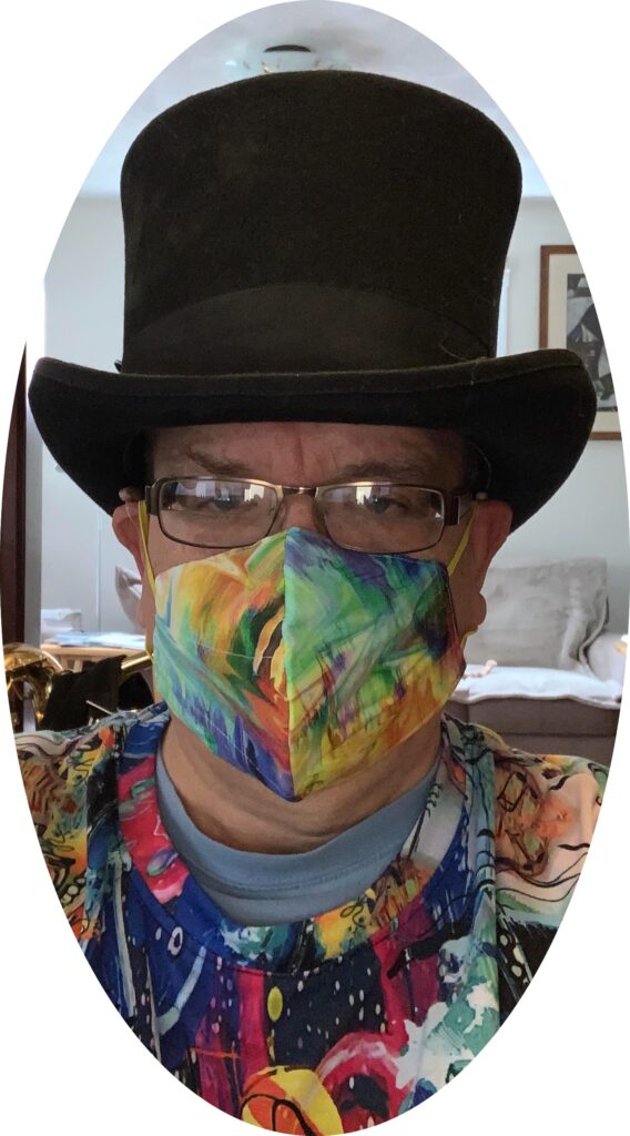 Man in top hat and colorful mask