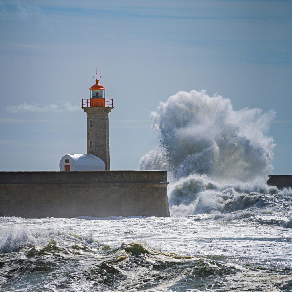 Lighthouse with waves splashing